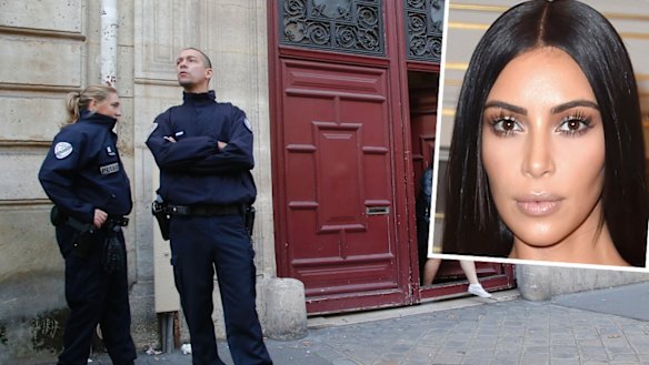 French police officers stand outside the residence of Kim Kardashian West in Paris.