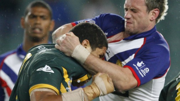 Old school: Willie Mason throws a punch during a Test against Great Britain in 2006.
