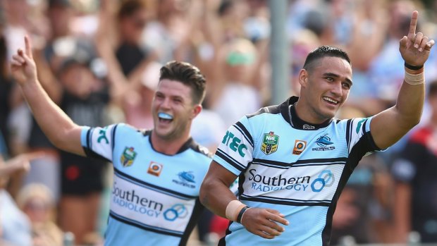 Chad Townsend and Valentine Holmes of the Sharks celebrate Holmes' try at Shark Park.