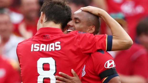 Sweet victory: Isaias and Henrique embrace after the latter's goal.