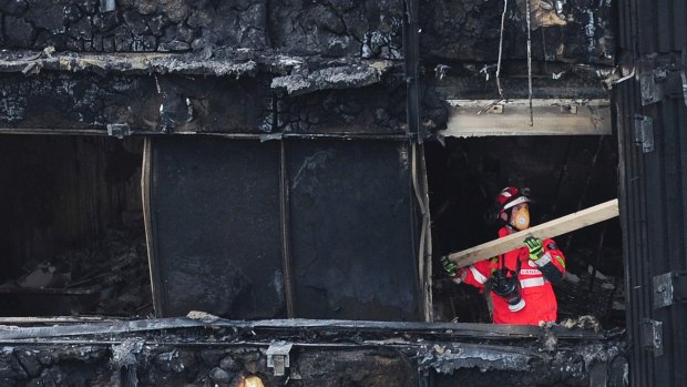 A London Fire Brigade officer inside the Grenfell Tower.