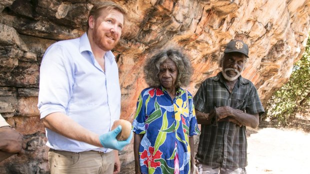 Associate Professor Chris Clarkson with traditional owners May Nango and Mark Djanjomerr. 