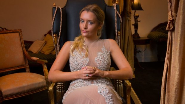 Zofia Krasicki tries on evening gowns at Oglia-Loro Couture in South Yarra for le Bal in Paris.