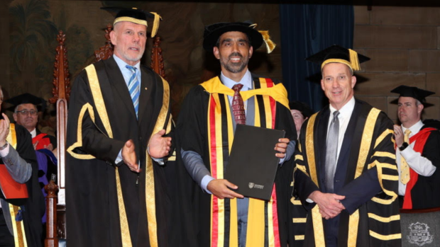 Honoris causa: Peter Fitzsimons presents Adam Goodes with an Honorary Doctorate of Health Sciences.
