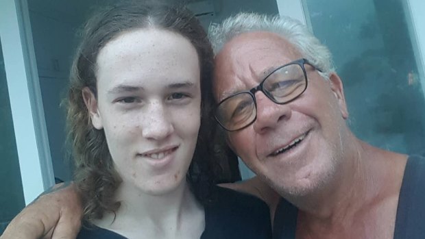 Retired WA police sergeant Graeme Johnson with his 15-year-old son in Sanur. 