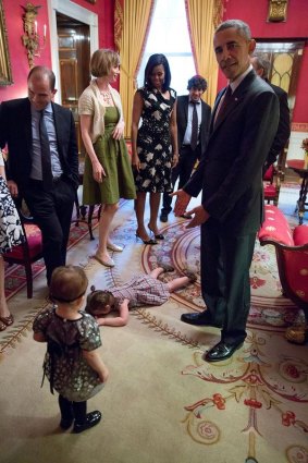 No I can't: Two-year-old Claudia Chaudhary on the floor of the White House Red Room.