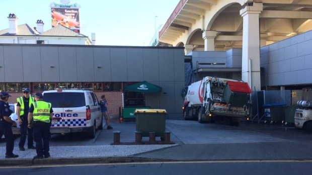 A man has been hit by his own garbage truck next to the Story Bridge Hotel.