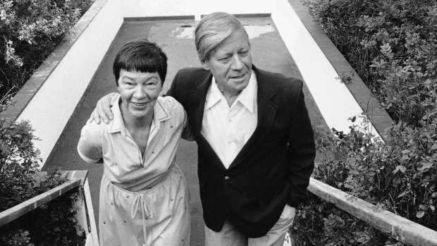 In this August 13, 1982, photo then West German chancellor Helmut Schmidt and his wife Hannelore walk upstairs near the Brahmsee, a little lake in northern Germany where the couple spent their summer holidays.