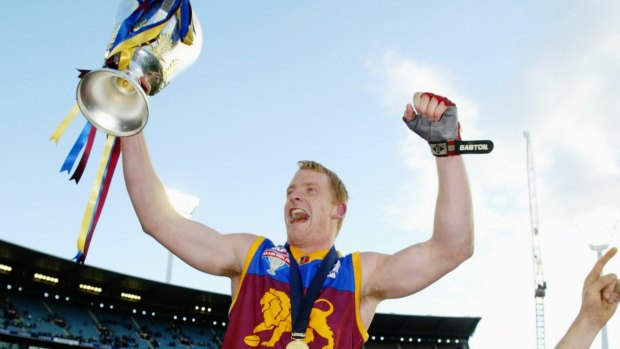 Hat-trick: Michael Voss and the Lions celebrate in 2003.