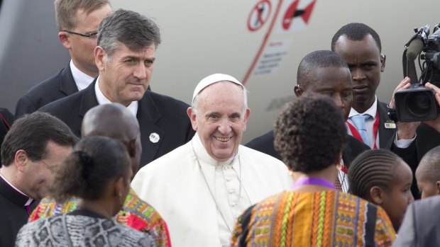 Pope Francis is greeted on his arrival at the airport in Nairobi, Kenya this week.