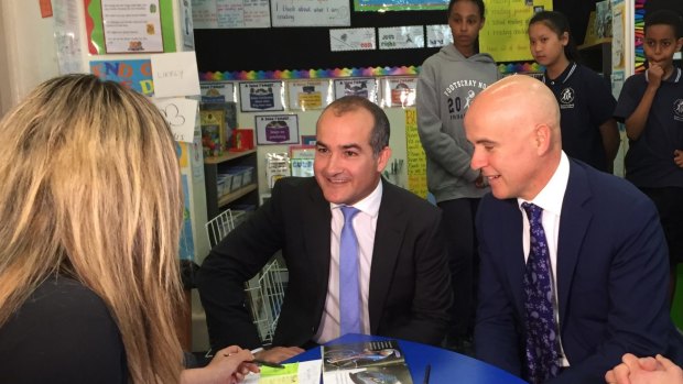 Victorian Education Minister James Merlino and NSW Education Minister Adrian Piccoli are taken on a tour of Footscray North Primary School. 