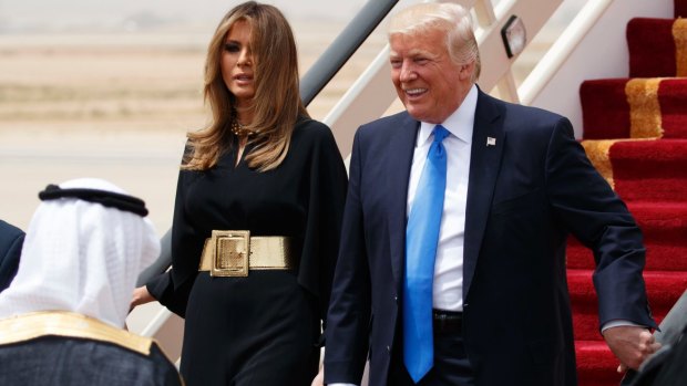 US President Donald Trump and first lady Melania Trump arrive at a welcome ceremony at the Royal Terminal of King Khalid International Airport.