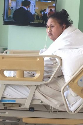 Eman sits up in a hospital bed on Monday.