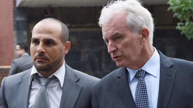 Toughest time: Hazem El Masri, centre, with lawyers Bryan Wrench, left, and Chris Murphy at Bankstown Local Court.