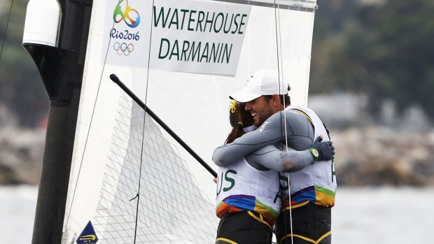 Australians Jason Waterhouse and Lisa Darmanin celebrate winning the silver medal in the Nacra 17 Mixed class on Day 11 of the Rio 2016 Olympic Games.