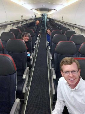 Dusty Johnson takes a selfie with colleagues on a mostly empty plane to Washington, DC. 