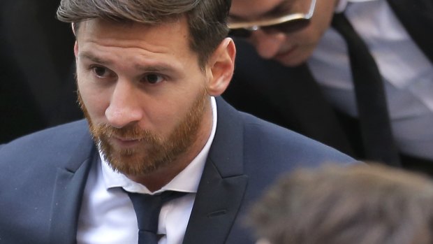 Barcelona soccer player Lionel Messi arrives at a court in Barcelona.