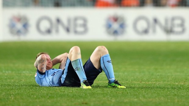 The agony: David Carney is dejected after the final whistle.