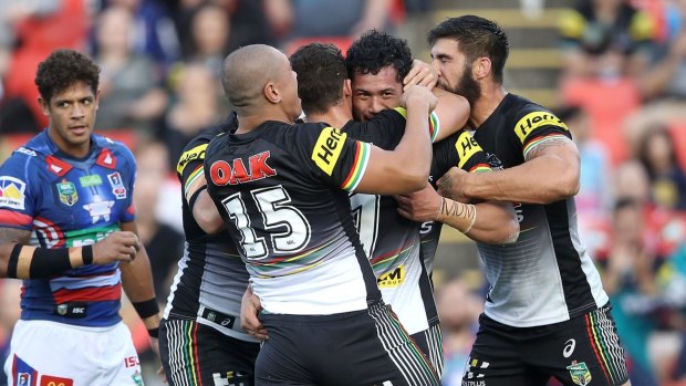 What a start: Corey Harawira-Naera celebrates with teammates after scoring a try on debut against the Knights – on his mum's birthday (see wrist strapping).
