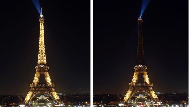 The Eiffel Tower with its lights switching off. 
