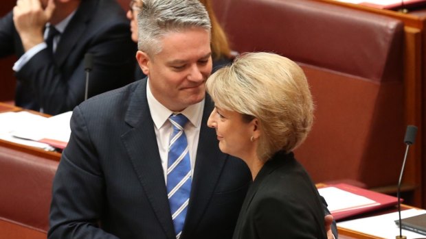 Employment Minister Michaelia Cash is congratulated by Finance Minister Mathias Cormann for the passing of the ABCC bill in the Senate on Wednesday.