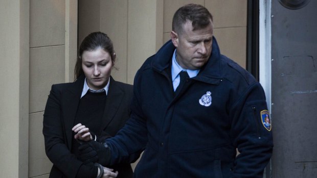Harriet Wran is escorted into a prison van after being sentenced.
