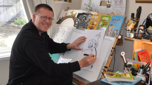 Canberra illustrator Tony Flowers in his studio.
