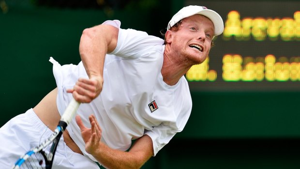 Matt Barton in action against Marcelo Arevalo, of Spain, during Wimbledon qualifying.