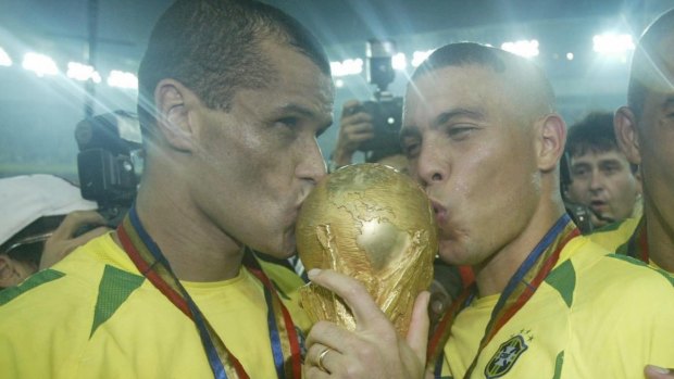 Rivaldo, left, kisses the World Cup after Brazil beat Germany 2-0 in the 2002 World Cup.