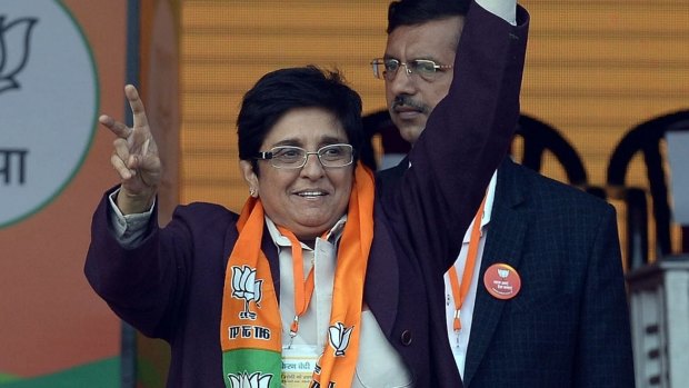 The Bharatiya Janata Partycandidate for Delhi chief minister, Kiran Bedi, waves during an election rally in New Delhi. 