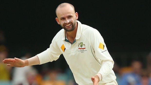 Success: Nathan Lyon celebrates his dismissal of New Zealand's Kane Williamson on day four of the first Test at the Gabba.