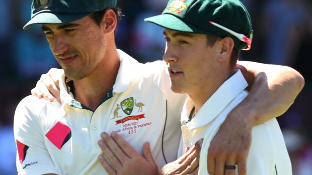 Bright start: Mitchell Starc embraces Matt Renshaw after Australia won the third Test against Pakistan in January.