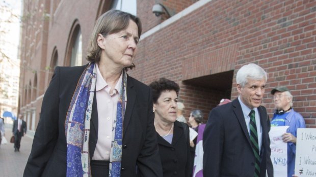 Members of the legal defence team for Boston Marathon bomber Dzhokhar Tsarnaev, including Judy Clarke (left), Miriam Conrad and David Bruck pass death-penalty protesters as they arrive in court this week.