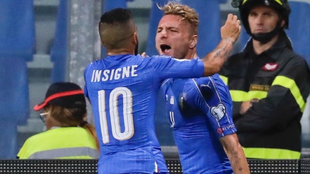 Italy's Ciro Immobile (right) celebrates with his teammate Lorenzo Insigne after scoring against Israel.