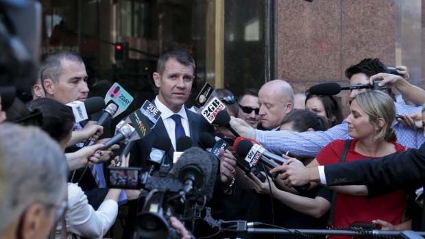 Premier Mike Baird addresses the press outside the reopened Lindt Cafe in Martin Place, the scene of December's siege.
