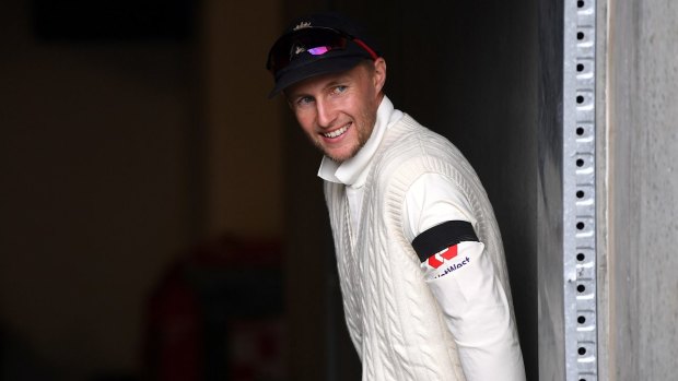 Joe Root stays upbeat during a rain delay.