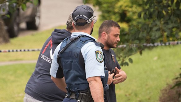 Tarek Assaad, right, outside the home where his brother Hamad Assaad was shot dead.