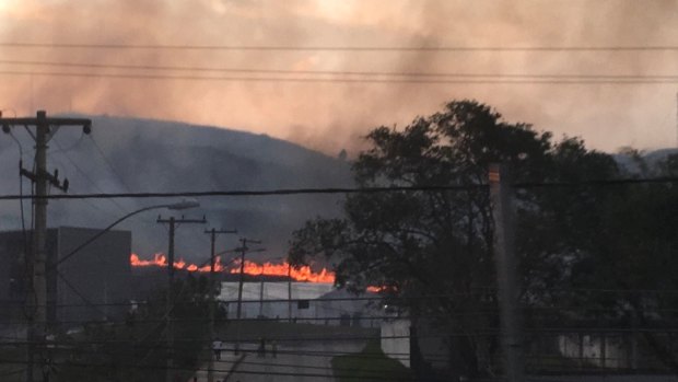 A fire burns near the Olympic field hockey venue in Rio on Monday.