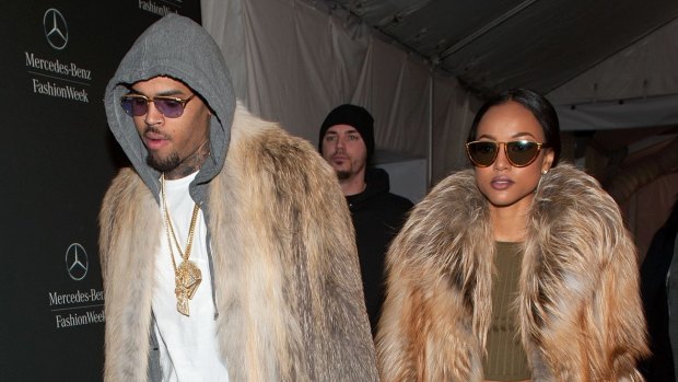 Chris Brown (L) and Karrueche Tran are seen during Mercedes-Benz Fashion Week Fall 2015 at Lincoln Center for the Performing Arts on February 17, 2015 in New York City.