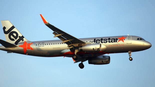 Jetstar have offered the couple $50 vouchers each while it investigates the alleged on-board behaviour by another passenger.