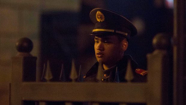 A paramilitary policeman guards the entrance to the North Korean embassy in Beijing on Friday.