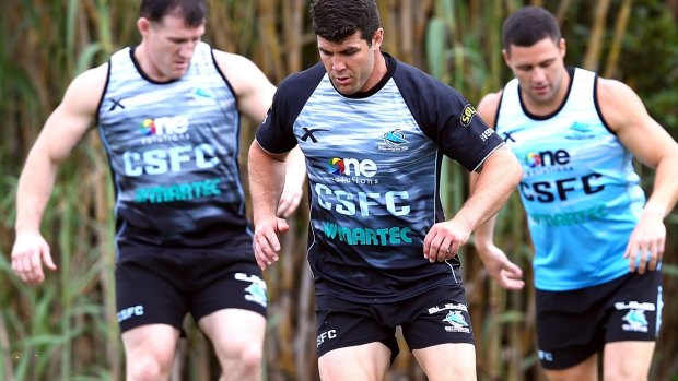 New Shark: Michael Ennis (centre) at training with Paul Gallen (left) and Michael Gordon.