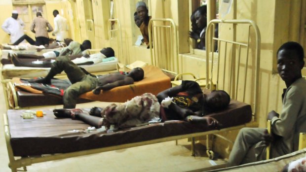 Injured males in hospital following the explosion in Kano, Nigeria, where a suicide bomber exploded as people were tucking into dinner.