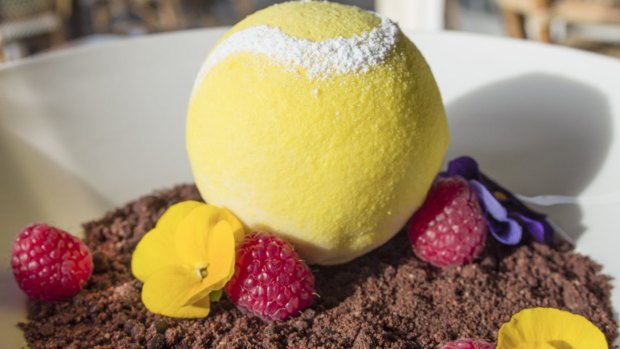 Tennis ball-shaped white chocolate mascarpone with raspberry centre and chocolate soil from Richmond Hill and Larder.