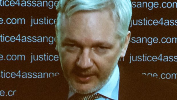 Julian Assange speaks via video link from the Ecuadorian Embassy in London.