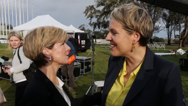 Julie Bishop and Tanya Plibersek talk after a media engagement outside Parliament. earlier this month. 