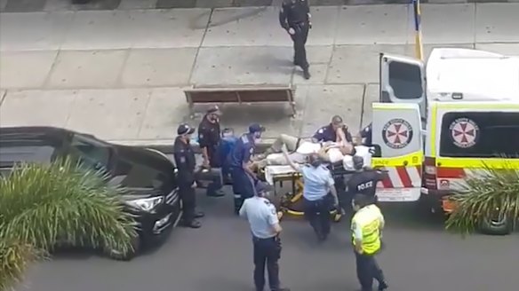 Television footage of the injured officer being taken to hospital. 