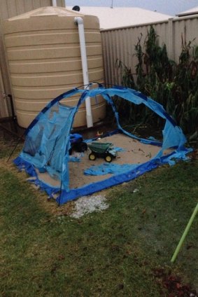 This tent protecting a young boy's sandpit stood no chance against the hail in Chinchilla.