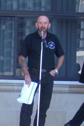 Motorcycle Riders Association of WA president Dave Wright speaks at a rally at Parliament House.