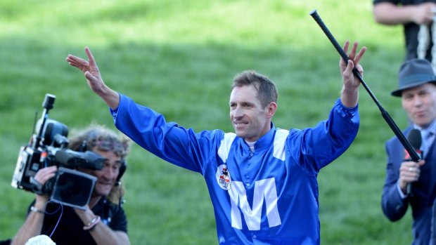 World's best: Jockey Hugh Bowman celebrates after winning the Cox Plate on Winx 
